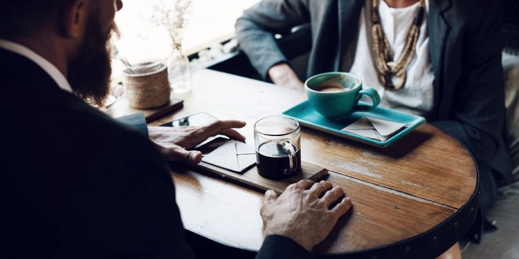 A busy man keeps working while he waits. | Image: Unsplash